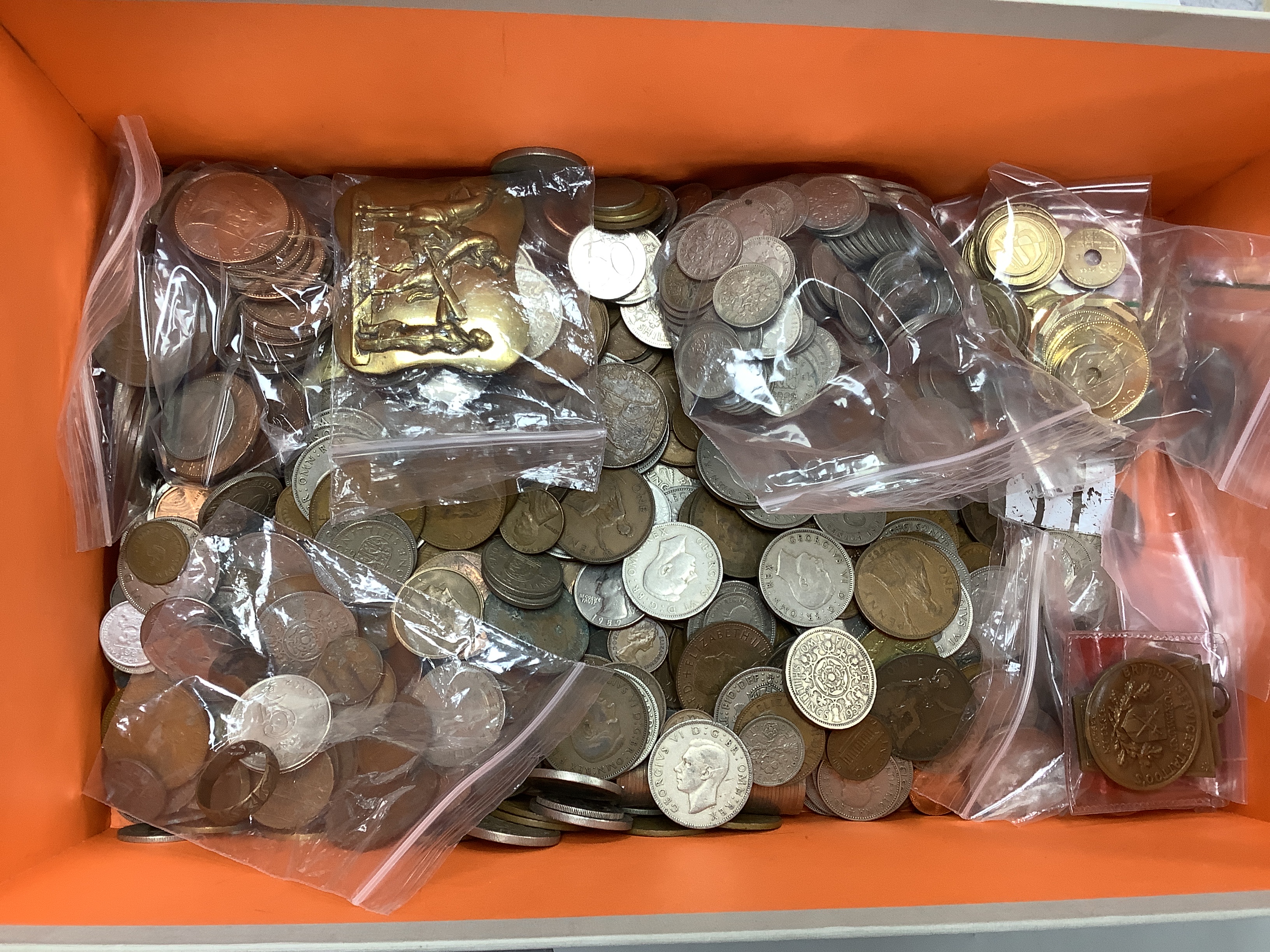 A box of UK and world coins and banknotes, a masonic steel fob seal and a Victorian brass belt buckle